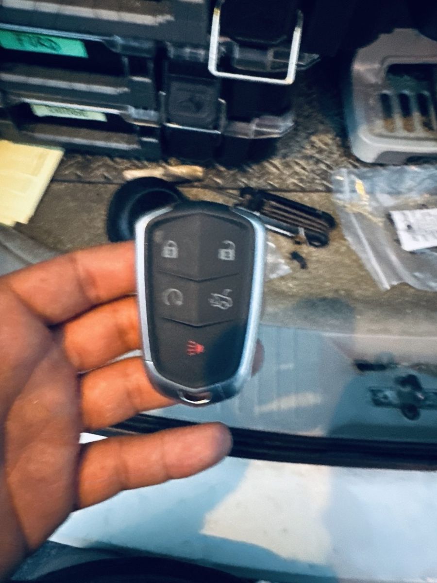 Cadillac smart key fob programmed in a PGA Village driveway by St Lucie Lock and Key.