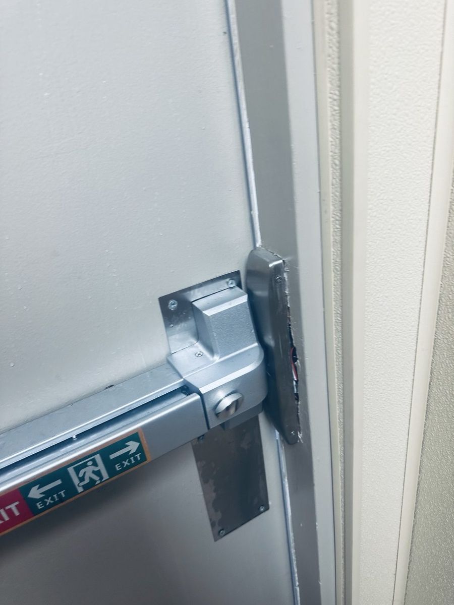 Commercial panic bar exit device repaired on a US-1 Port St. Lucie storefront by St Lucie Lock and Key.