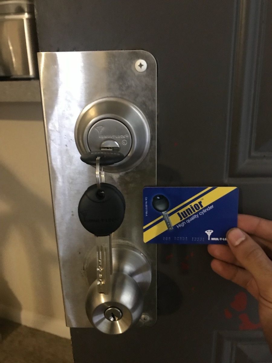 Mul-T-Lock high-security commercial cylinder installed on a St. Lucie West storefront by St Lucie Lock and Key.